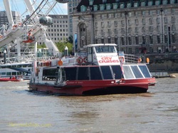A City Cruises tour boat on the Thames in London.