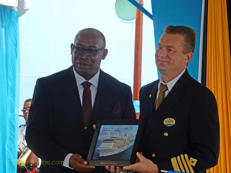 Captain Hendrick Sorensen, Master of Anthem of the Seas, presenting a plaque to Hon. Stephenson King, Minister of Infrastructure, Port Services and Transport of St. Lucia